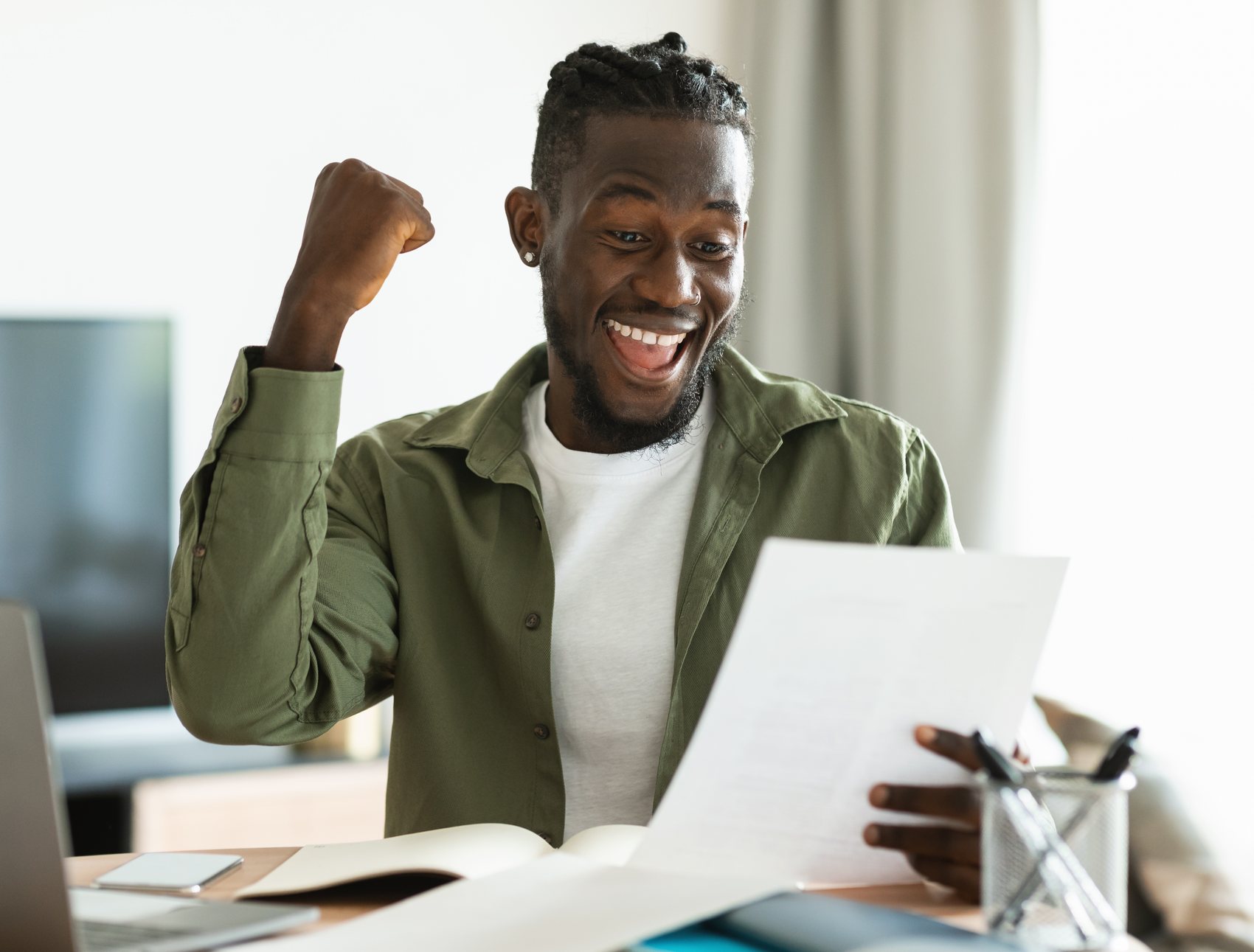 A South African taxpayer reading a SARS assessment at her kitchen table