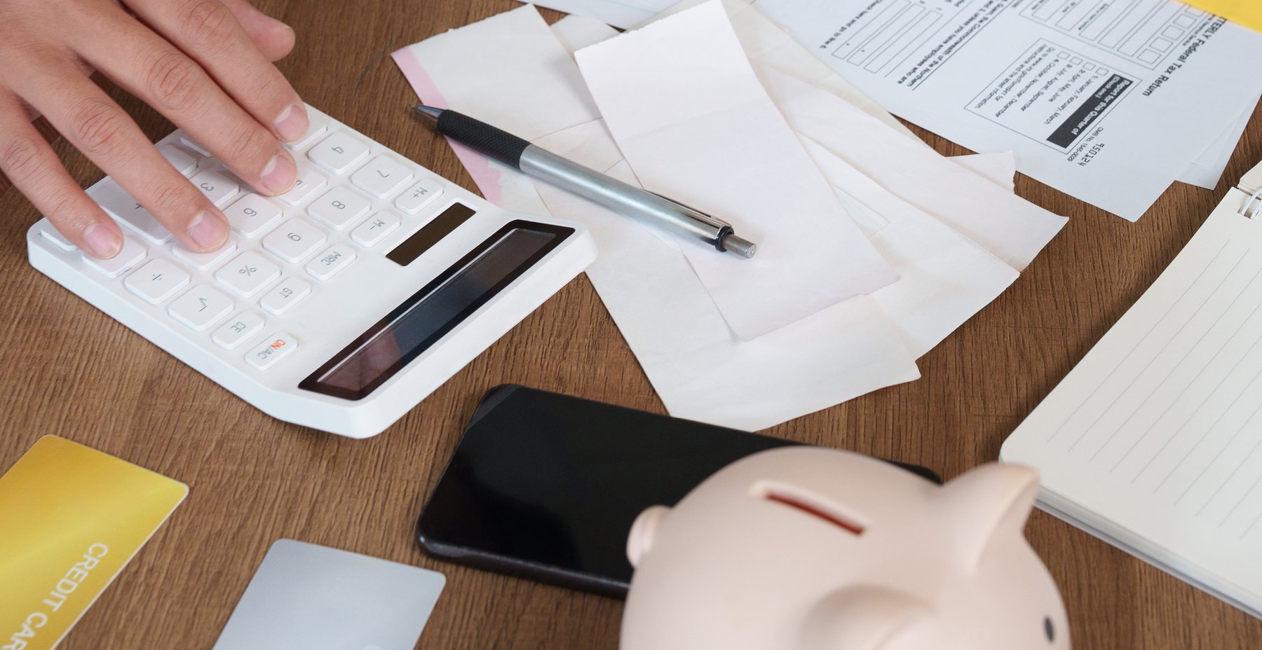 Tax paperwork and a calculator on a desk